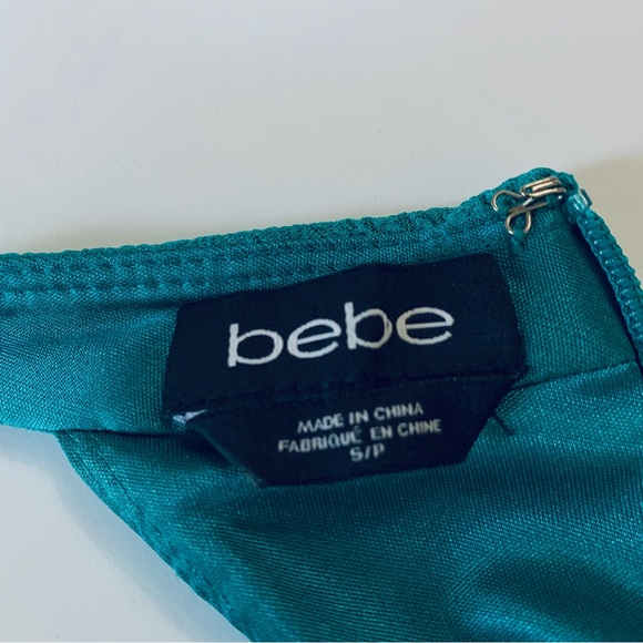 OFF  BEBE TEAL BODYCON RIBBED CUTOUT MINI DRESS - Picture 11 of 15